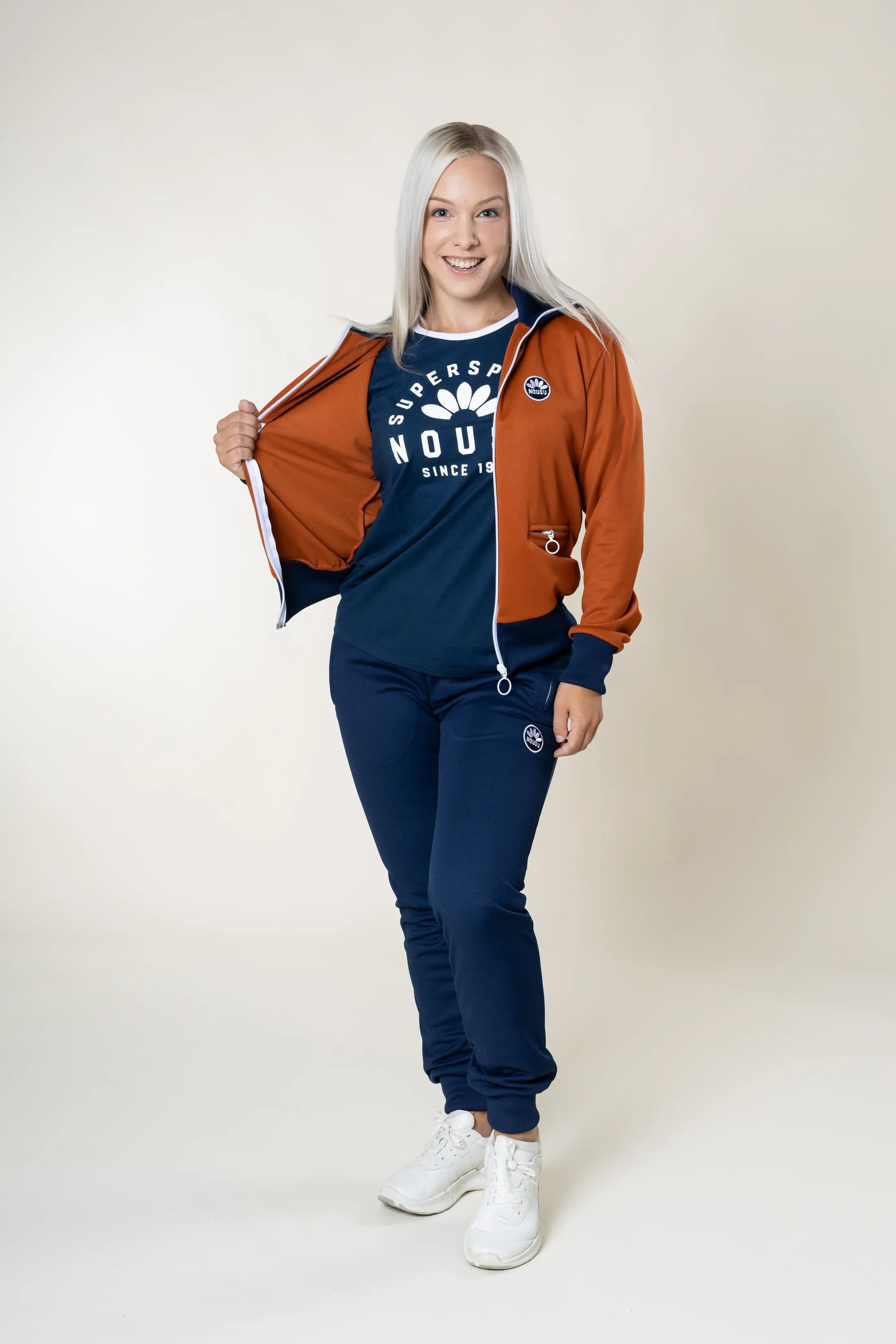 Nousu Ruoste verryttelytakki naiset