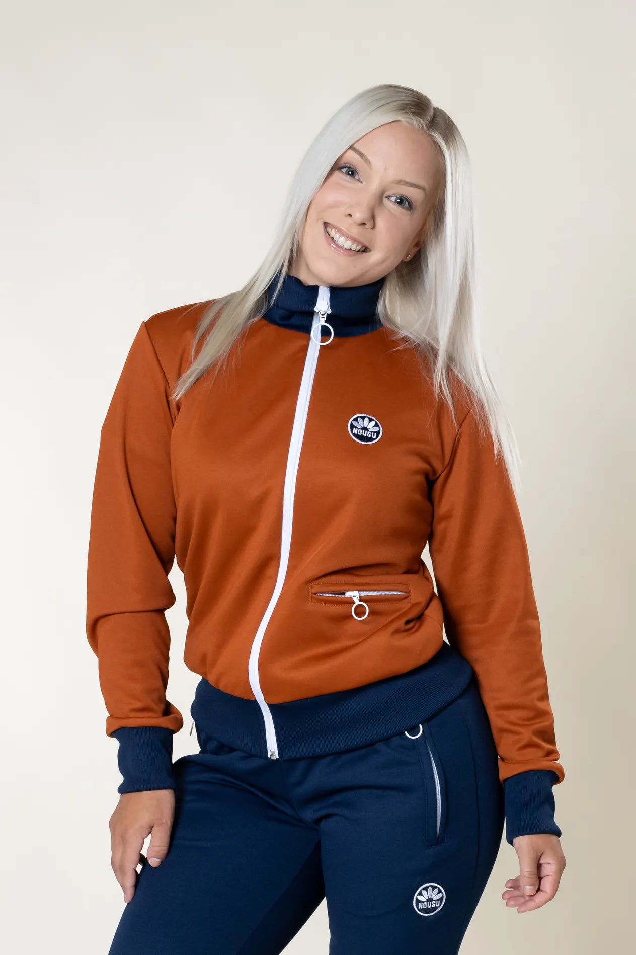 Nousu Ruoste verryttelytakki naiset